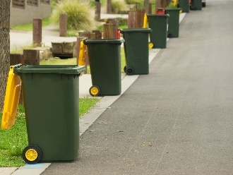 Recycling bins on a street.